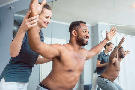 Young man receiving physical therapy after sport injuryの写真素材