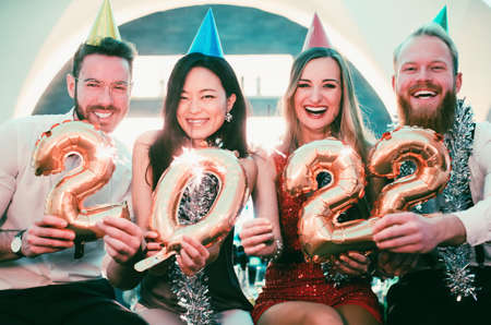 Men and women celebrating the new year 2022の写真素材