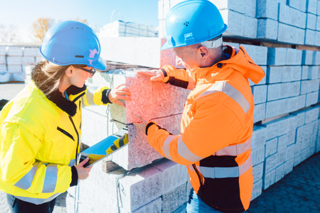 logistics worker with construction material to be transported