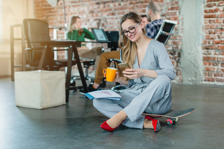Business woman in fresh company with loft officeの写真素材