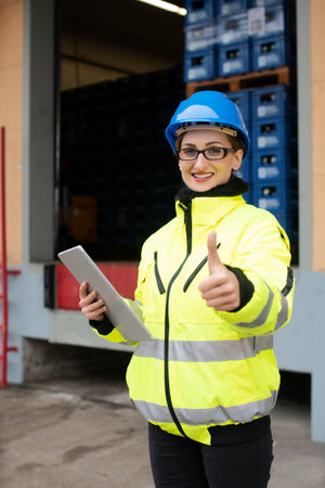 Worker woman checking delivery of food supplies in warehouse