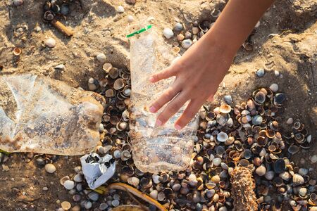 Garbage on the beach, waste picking conceptの写真素材