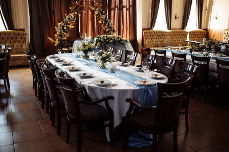 Wedding table decorations, flowers and vintage elements. Guest table setting on the wedding day....