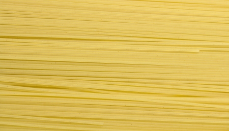 Background of uncooked  pasta Spaghettiの写真素材