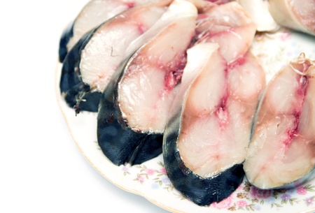 a piece of herring on the plateの写真素材