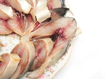 a piece of herring on the plateの写真素材