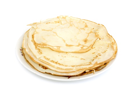a lot of pancakes on a plate isolated on white backgroundの写真素材