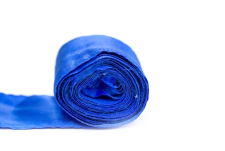 blue silk ribbon on a white backgroundの写真素材