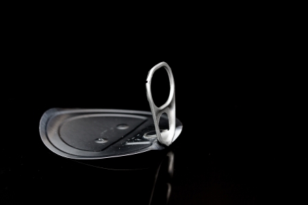 tin can ring pull isolated on a black backgroundの写真素材