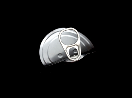 tin can ring pull isolated on a black background