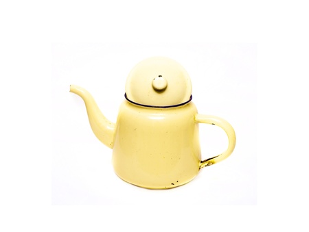 yellow teapot isolated on white backgroundの写真素材