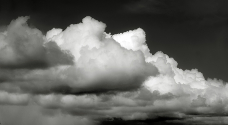 White clouds on black background.