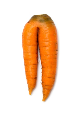 carrot with two "legs" isolated on whiteの写真素材