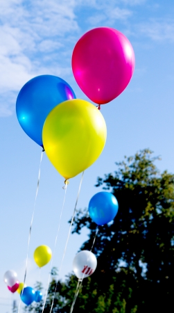 multicolored balloons with numbers on a background of skyの写真素材