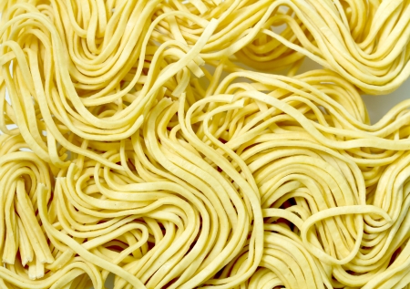 pasta noodles on a white backgroundの写真素材