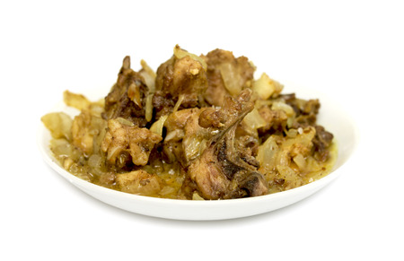 Fried chicken with onion on a plateの写真素材