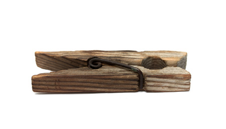 old clothes-pin isolated a white backgroundの写真素材