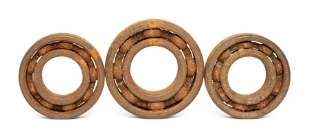 Old and rusty ball bearing, isolated on white backgroundの写真素材