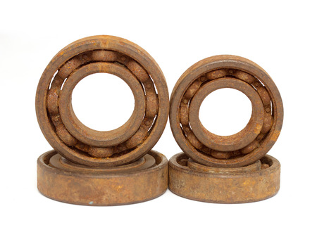 Old and rusty ball bearing, isolated on white backgroundの写真素材