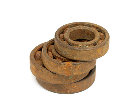 Old and rusty ball bearing, isolated on white backgroundの写真素材