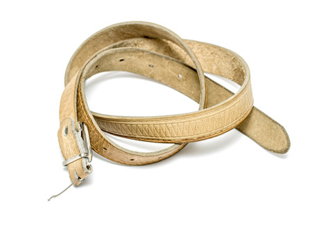 old leather belt on white background
