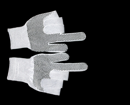 white workers glove isolated on a black background.の写真素材