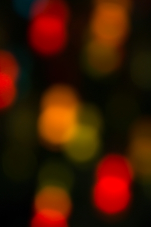 holiday bokeh blurred on a dark backgroundの写真素材
