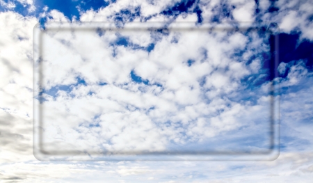 transparent frame for your text on a background of blue sky with cloudsの写真素材