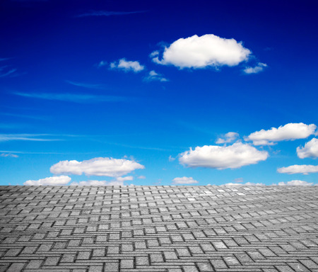 paving stone floor with cloud and blue skyの写真素材