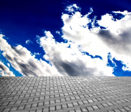 paving stone floor with cloud and blue skyの写真素材