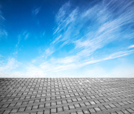 paving stone floor with cloud and blue skyの写真素材