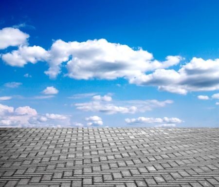 paving stone floor with cloud and blue skyの写真素材