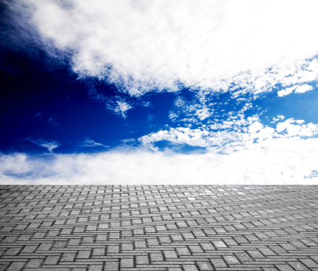 paving stone floor with cloud and blue skyの写真素材