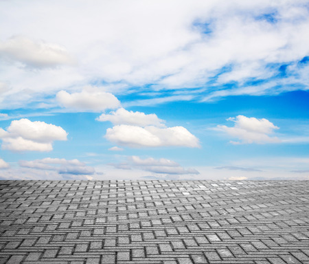 paving stone floor with cloud and blue skyの写真素材