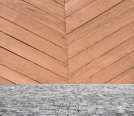 wooden fence rough background and vintage stone pavement foregroundの写真素材