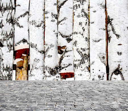 wooden fence rough background and vintage stone pavement foregroundの写真素材