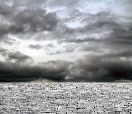 wooden fence rough background and vintage stone pavement foregroundの写真素材