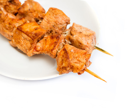 fresh roast chicken shish kebab on white platterの写真素材