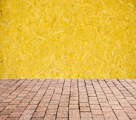stone pavers on the background of wooden wallの写真素材