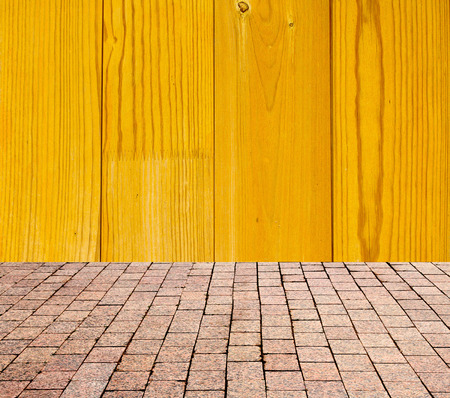 stone pavers on the background of wooden wallの写真素材