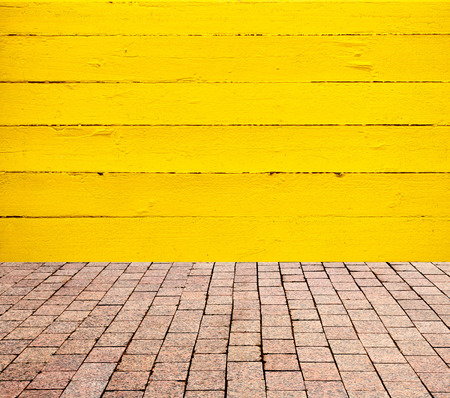 stone pavers on the background of wooden wallの写真素材