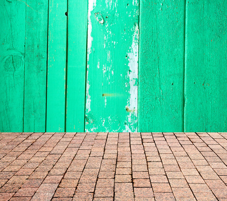 stone pavers on the background of wooden wallの写真素材