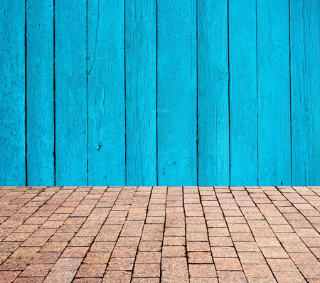 stone pavers on the background of wooden wallの写真素材