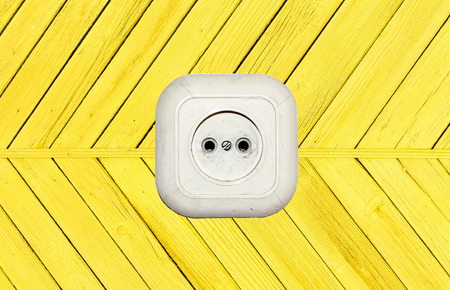 old white socket on a wooden backgroundの写真素材