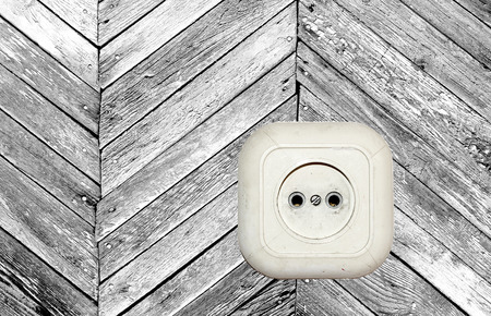 old white socket on a wooden backgroundの写真素材