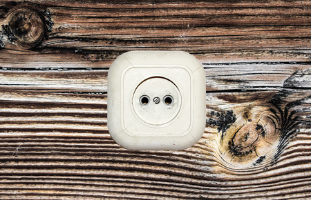 old white socket on a wooden background