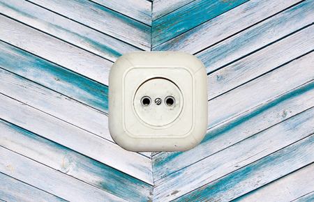 old white socket on a wooden backgroundの写真素材