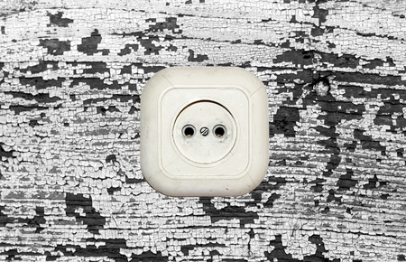 old white socket on a wooden backgroundの写真素材