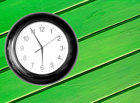 Wall Clock on Wooden Backgroundの写真素材