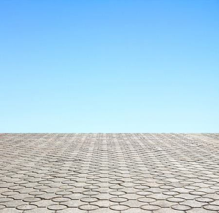 decorative paving stone on a background of blue skyの写真素材